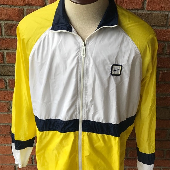 yellow white and blue nike windbreaker